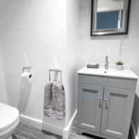Shaker style basin unit with close coupled toilet, with chrome brass wear and accessories