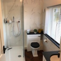 Traditional toilet unit with back-to-wall toilet, walk-in shower and traditional basin unit